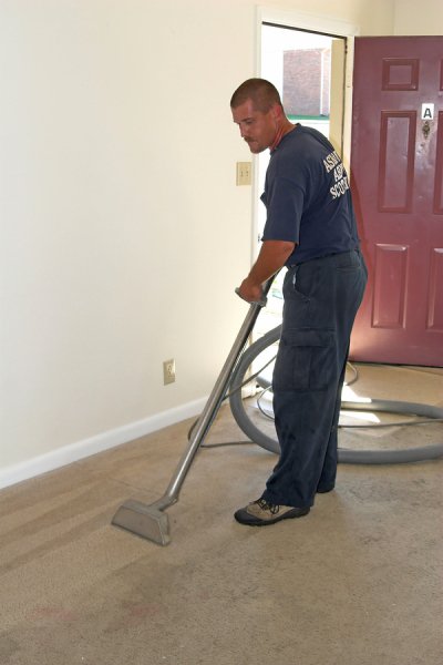 A man cleaning there house