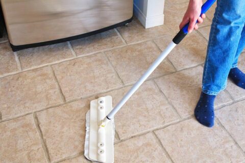 man cleaning a floor