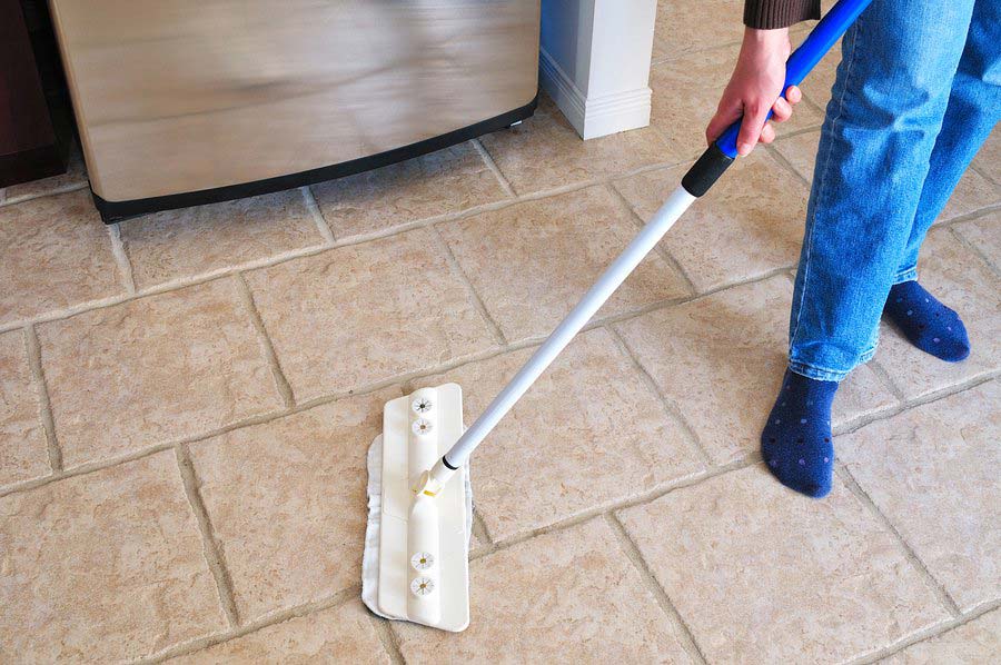 man cleaning a floor