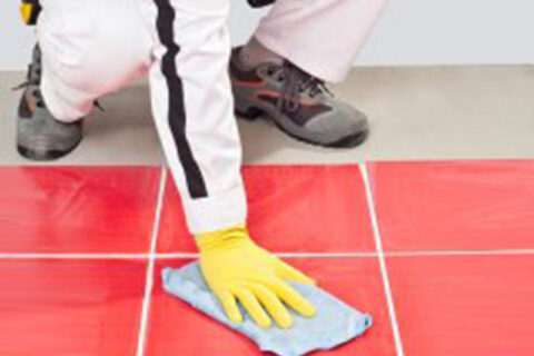 man cleaning a floor