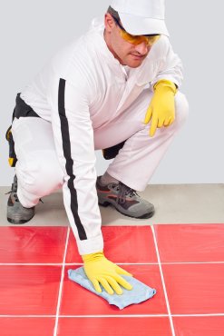 man cleaning a floor