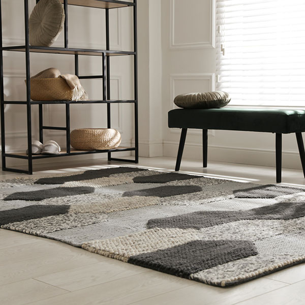 area rug in room with bench and shelves