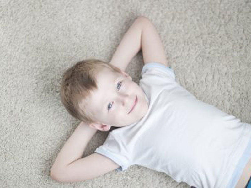 kid lying on the floor
