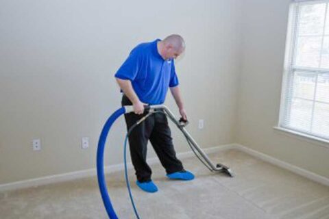 A man cleaning there house