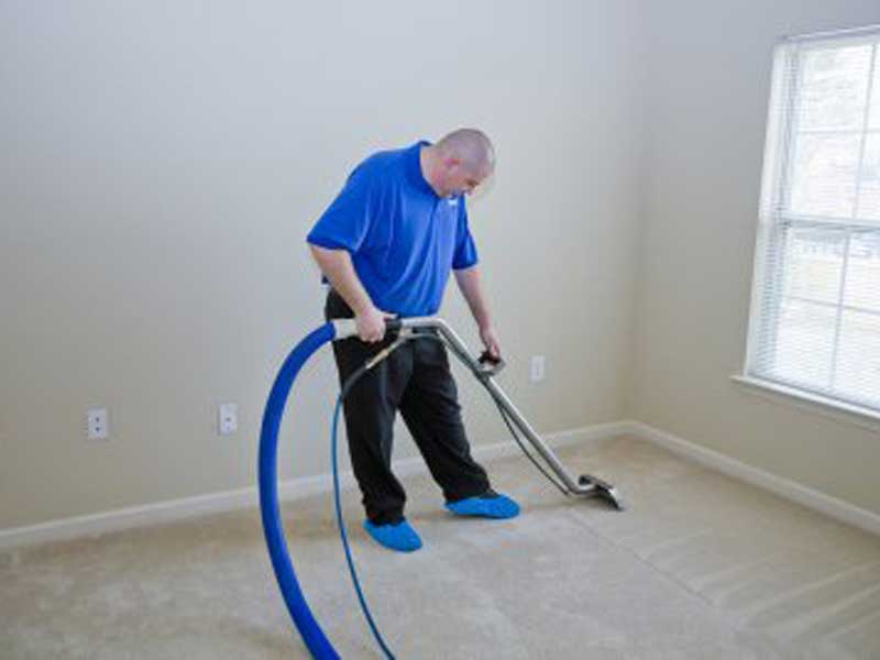 A man cleaning there house