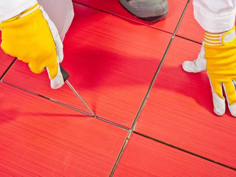 installing floor tiles